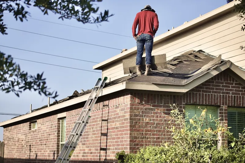 Professional roofer working on a residential roof in Mountain Ridge Estates
